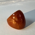 Macro detail of oval amber resin ring with natural marble texture and polished finish - Caramel(32358)