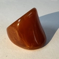 Detail of amber acrylic oval ring with thick geometric design and resin marbling texture - Caramel(32355)