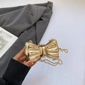 Golden bow-shaped metallic mini crossbody bag with a refined chain strap and glossy finish - Gold
