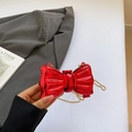 Mini red metallic bow-shaped hard shell clutch with a detachable gold chain strap - Red
