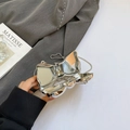 Mini silver bow knot crossbody bag with metallic chain strap and built-in mirror - Silver