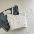 Floral drawstring shoulder bag with pink tulip patterns and decorative bows on white - Butterfly