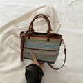 Colorful striped straw bucket bag with brown leather handle and gold hardware - Brown