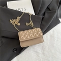 Chic khaki quilted crossbody bag with golden chain strap on a black blazer - Khaki