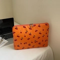 Orange laptop sleeve with cherry pattern and secure dual metal zippers for protection - Orange