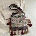 Bohemian ethnic shoulder bag with colorful geometric patterns and fringe details - Beige