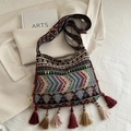 Bohemian woven crossbody bag with colorful ethnic patterns and long decorative tassels - Green