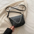Black pleated bucket bag with silver metal chain strap and subtle cartoon prints - Black