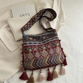 Ethnic jacquard crossbody bag with bohemian tassels and wide patterned strap - Red