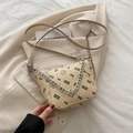 Creamy beige bucket bag with bear print, lychee texture, and silver chain strap - Khaki