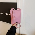Pink litchi texture crossbody phone bag with stylish woven knot strap for summer - Pink