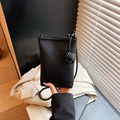 Minimalist black lychee leather mini crossbody phone bag with woven ball drawstring - Black