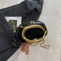 Black semi-circular leather handbag with gold oval metal handle and snake chain strap - Black