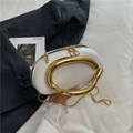 Chic white oval mini chain bag with an oversized gold metal handle and serpent strap - White
