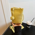 Chic yellow lychee leather mini phone bag with trendy woven knotted shoulder strap - Yellow