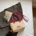 Women's summer straw bucket bag in beige with bright rose red leather trim and long strap - Rose Pink