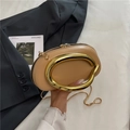 Chic tan mini chain bag featuring a large circular gold handle and snake chain strap - Khaki