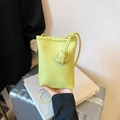 Lime green textured leather mini crossbody phone bag with minimalist decorative knot detail - Green