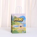 Detailed shot of white kraft gift bag featuring colorful hiking and mountain illustrations - Hiking Adventure Theme (481-3)