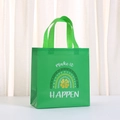 Close-up of green non-woven shopping bag featuring a rainbow motif and make it HAPPEN text - Make it HAPPEN Rainbow Style (5028-5)