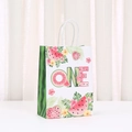 Detail of white paper gift bag with watermelon ONE design and tropical leaves motifs - ONE First Birthday Watermelon Style (523-2)