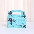 Detail of light blue Halloween gift box with spider print and built-in handle - 16x9x9cm