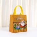 Detalle de bolsa de regalo navideña de tela no tejida con Papá Noel y asas amarillas - 23*22*11cm