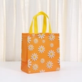 Orange non-woven shopping bag featuring white and yellow daisy prints with yellow handles - 23*22*10 / Bright Orange