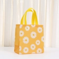 Vibrant yellow non-woven shopping bag featuring a large white daisy flower print design - 23*22*10 / Bright Yellow