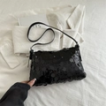 Elegant black sequin shoulder bag with adjustable strap on minimalist white background - Black