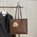 Deep brown leather tote bag with long straps and plush star charm on office background - With Pendant / Brown