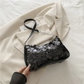 Chic black sequined underarm shoulder bag featuring a silver chain and leather strap - Black