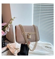 Detail of nude crocodile texture bag with gold heart padlock and dual chain straps - Khaki
