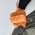 Orange polka dot PU leather clutch bag featuring a large bow and wristlet strap - Orange