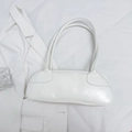 Borsa a spalla baguette minimalista in ecopelle bianca con design aerodinamico - Bianco