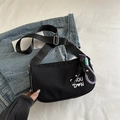Black nylon underarm bag with white logo print and adjustable shoulder strap - With Charm / Black