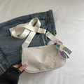 Cream nylon shoulder bag with heart embroidery and colorful woven rope charm - With Charm / Light Khaki