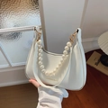 White faux leather baguette bag with large pearl handle and gold chain detail - Off White