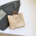 Floral brocade tote bag with bamboo handle in light gold with 3D embroidery detail - Pink