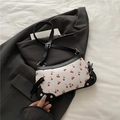 Borsa a spalla bianca con stampa ciliegia, bordi neri e fiocchi decorativi - Nero