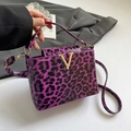 Chic purple leopard print glossy handbag with golden V hardware and shoulder strap - Purple