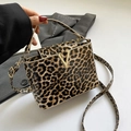 Leopard print crossbody bag with glossy finish and gold V-shaped metal buckle - Yellow