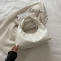 Glossy creamy white faux leather half-moon hobo bag with seamless handle and minimalist design - White