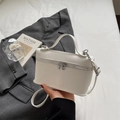 Minimalist white litchi pattern crossbody bag with silver hardware and top handle - Off White