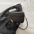 Crossbody camera bag featuring brown M-pattern monogram and adjustable leather strap - Brown