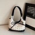 Fashionable contrast black and white tote bag with bow accent and embossed texture - Black