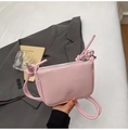 Pink lychee texture leather mini crossbody bag with braided strap and metal zipper detail - Pink
