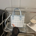 Blue checkered mini tote bag with dual handles and crossbody strap on display - Blue