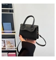 Detail of black lychee texture mini handbag with gold hardware and detachable strap - Black