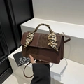 Brown textured handbag with leopard print scarf accent and adjustable shoulder strap - Brown